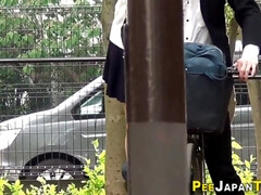 Embarrassed asian pissing