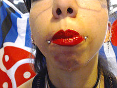 Bright Red Lipstick Drooling A pile of saliva and drool