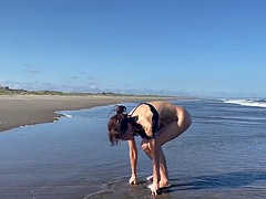 Striptease and naked dance on the beach, she loves being completely naked