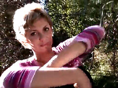 Busty blonde MILF gets naked outdoors