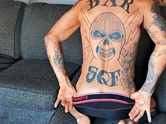 Tattooed jock with big cock wanks cock and toys ass in solo session