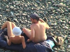 Voyeur on public beach. Oral sex