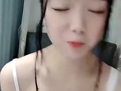 Horny asian amateur teen in mask toying on webcam