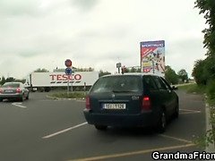 Granny swallows two cocks in the fields