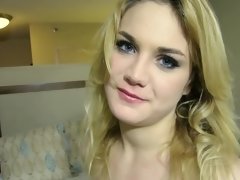Adorable teen with blue eyes and golden hair is giving a blow job