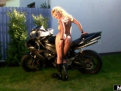 Hot blonde sits on a motorcycle and rubs her pussy! - Big tits