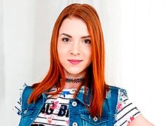 Red-haired cutie rides photographer's dick