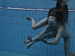 two hot lesbians in the pool loving eachother