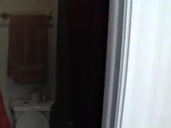 Hot babe shows big breasts in the shower while shaving