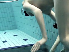 girls swimming underwater and enjoying eachother