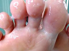 Saliva spit on her feet