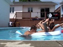 Poolside orgy with pussy eating and strap on fucking