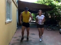 Vintage video of a fitness trainer and a busty chick