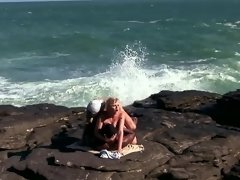 Hot blonde screwed on the beach by white and black guys