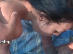 Dark-haired callgirl has to satisfy sex hungry guys outdoors