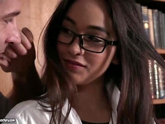 Gorgeous brunette librarian with glasses, Ginebra Bellucci is sucking cocks instead of reading books