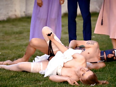 A man in a dog mask is fucking the bride while outside