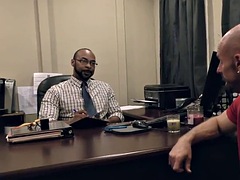 Black doctor taking something out of a white guys ass