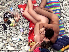 youthfull couple having intercourse on the beach